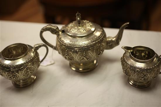 An early 20th century Indian silver three piece tea set, gross 23 oz.